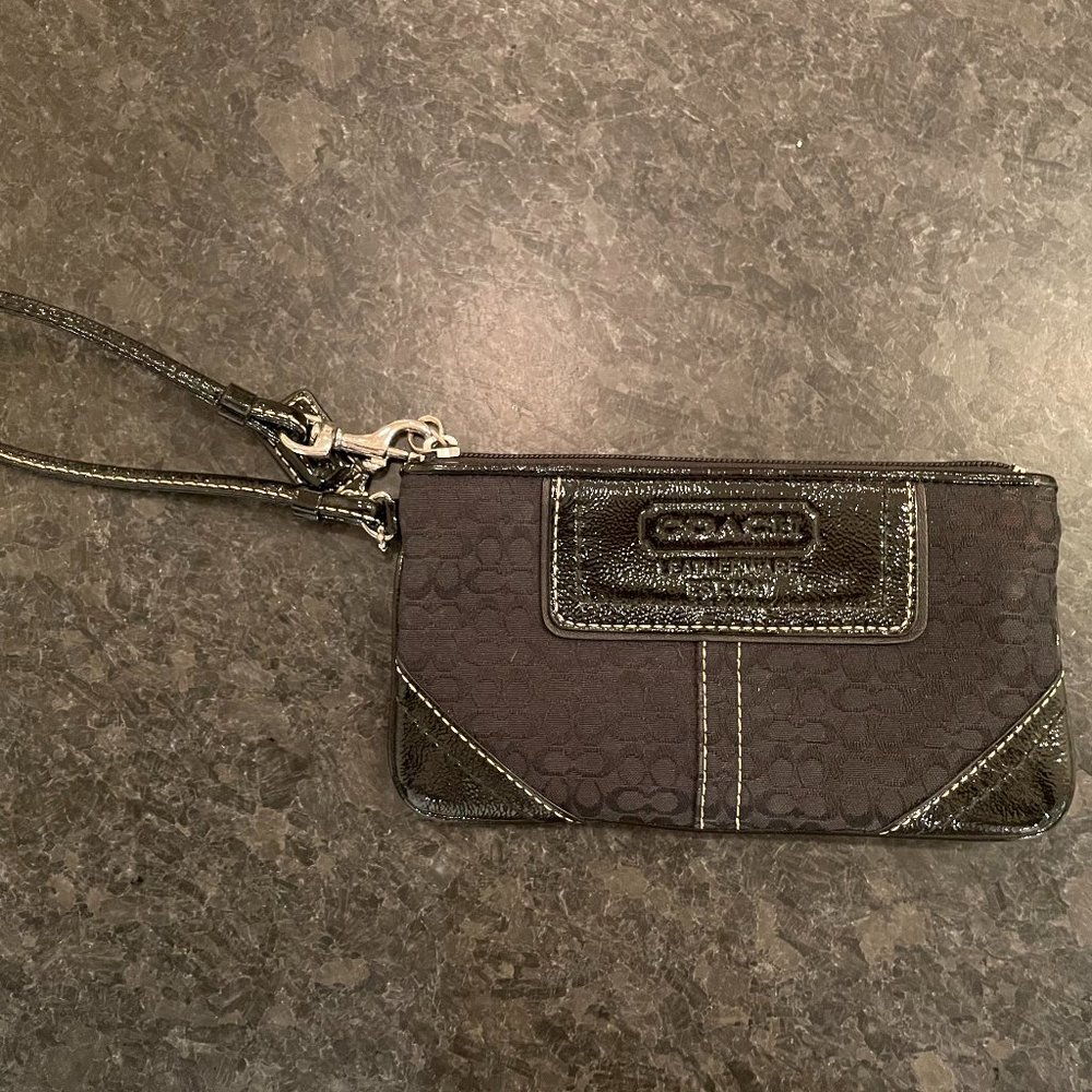 COACH wristlet in signature black fabric with black leather accents